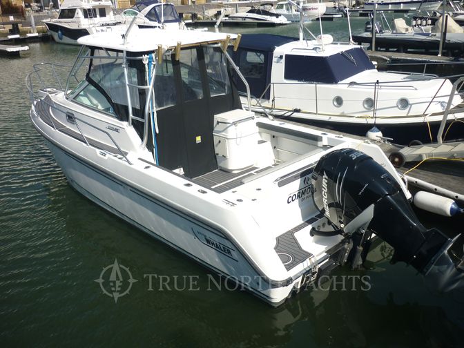 conquest 26 with the hood on, and the waterproof doors  and windows covering the cockpit