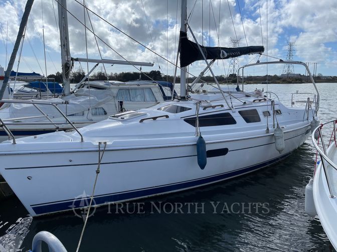 Hunter 326 is a white sail boat