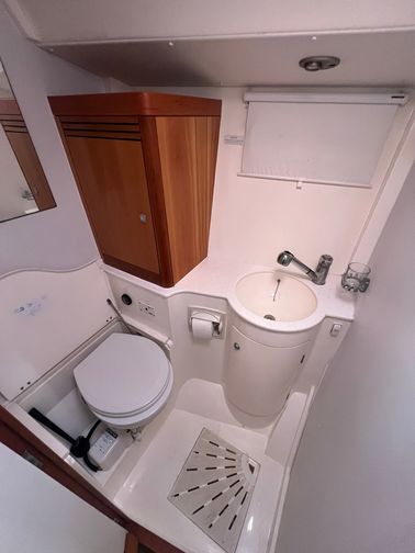 the 2nd bathroom of the boat, with a toilet and sink